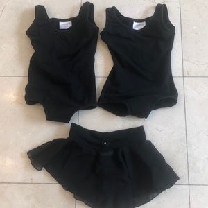 Two black Capezio leotards and a sheer black skirt